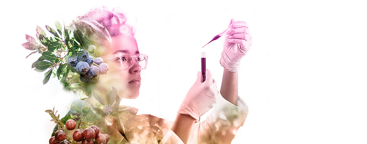 female scientist working a concentrate, her blouse is made from berries