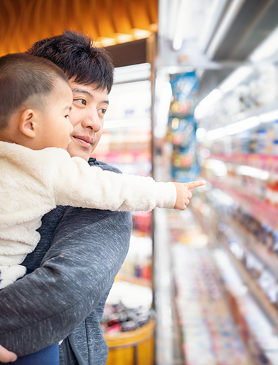Taiwanese father and son shopping in a supermarket