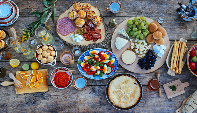 Top view of a wooden table full of various food