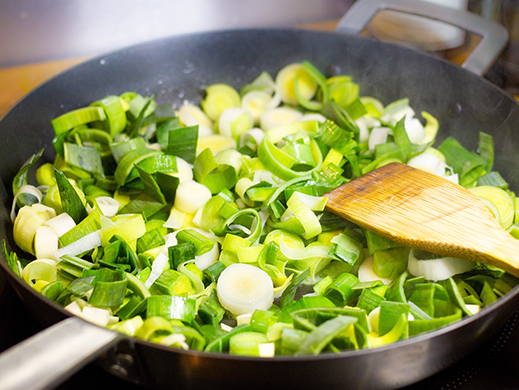 Culinary preparation with leek cooking in a pan