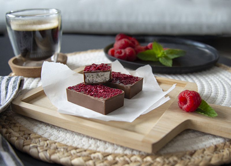 Raspberry crunchies ingredients on top of chocolate 