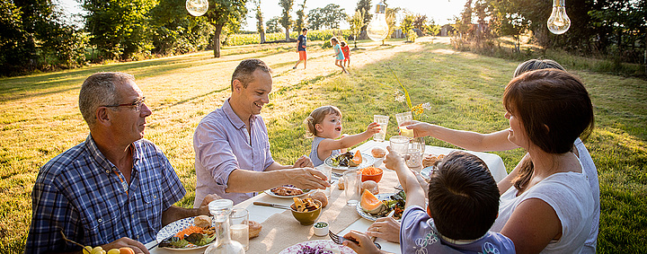 family picnicking outdoors