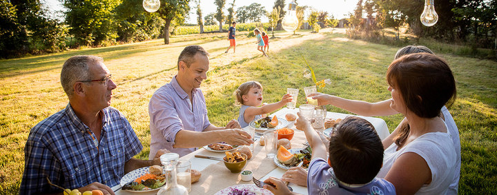 family picnicking outdoors