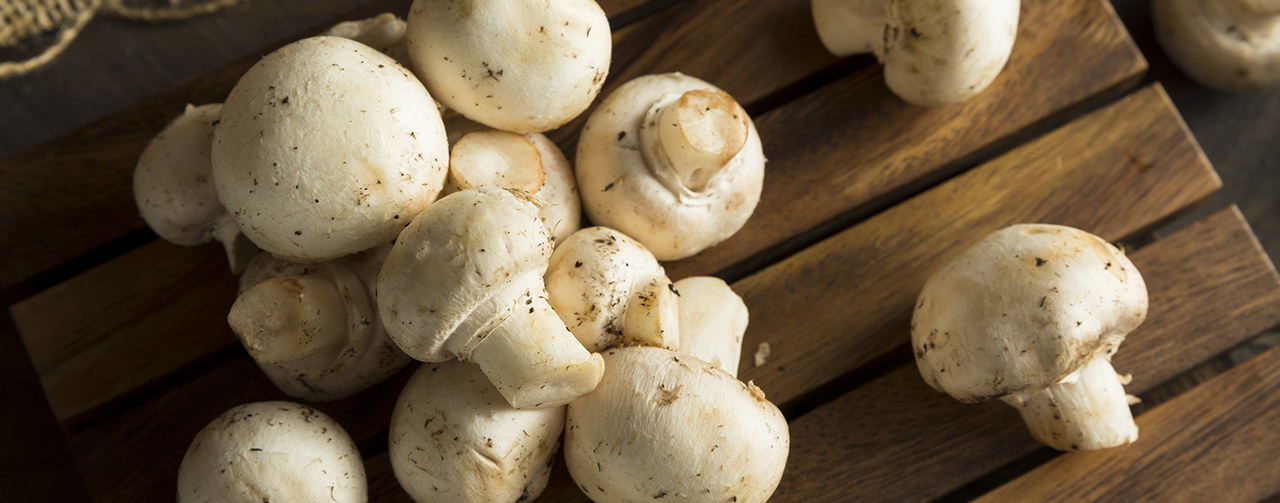 Top view of fresh mushrooms ingredients on wooden table