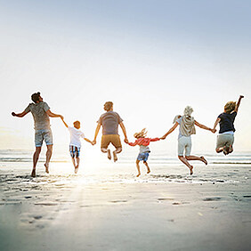 healthy people jumping on a beach