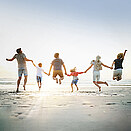healthy people jumping on a beach