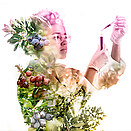 female scientist working a concentrate, her blouse is made from berries