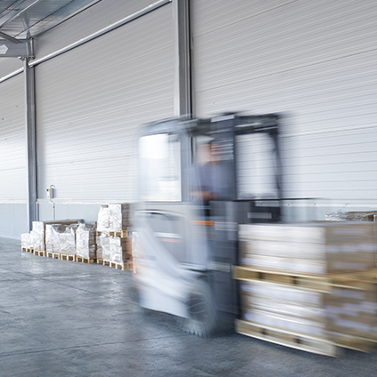 Forklift truck loading lorry