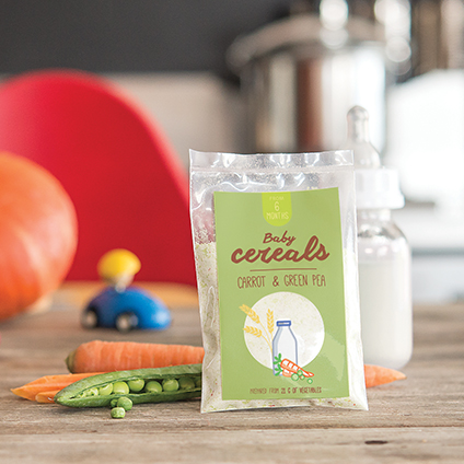 Babyfood infant cereals on wooden table with vegetable and baby bottle