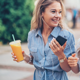 Sisters in streets holding on-the-go juices