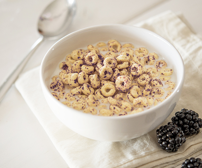 Bowl of breakfast cereals with blackcurrant ingredients