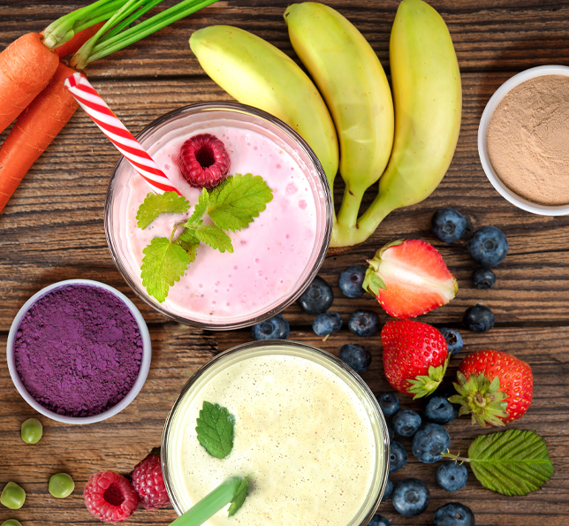Top view of colorful smoothies with berries and fruits