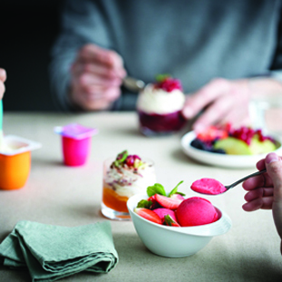 Family eating yogurt, ice creams and desserts 