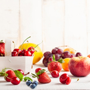 Fruits on wooden table - Berries, apple, peach, pear acerola, grappe