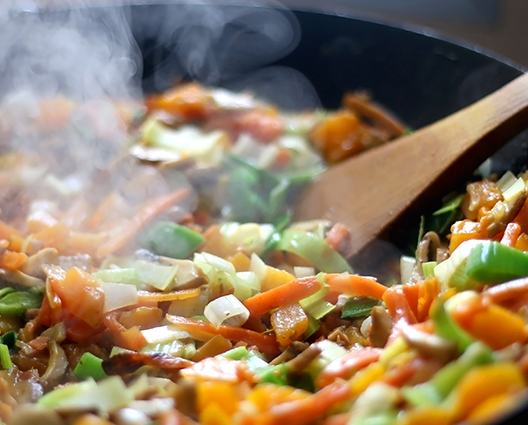 cooking a culinary preparation in a pan
