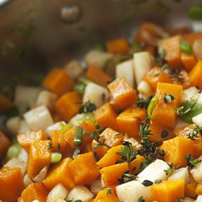 Culinary preparations with herbs and vegetables in a saucepan