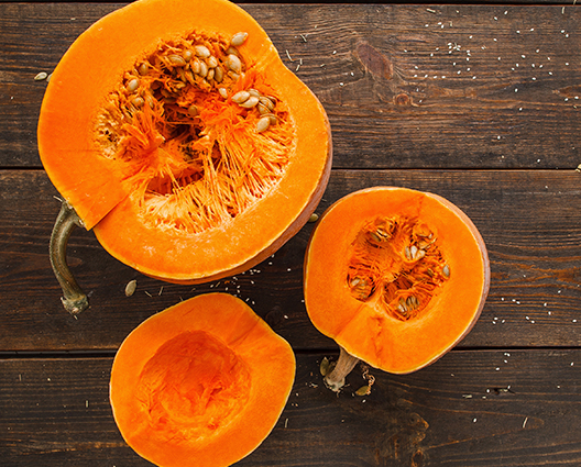 Top view of cutted pumkins on wooden table