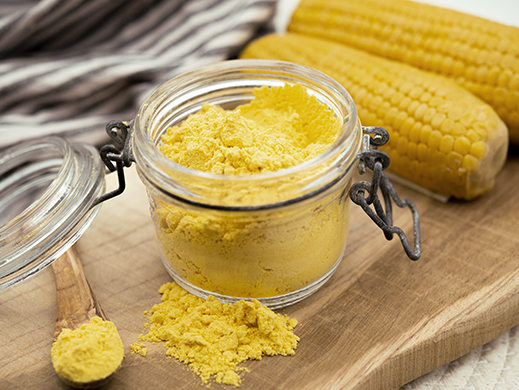 super sweet corn powder with raw corn on table