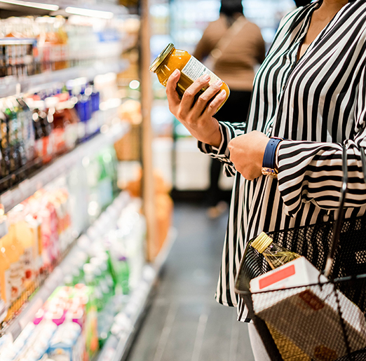 Asian woman looking labeling in a supermarket