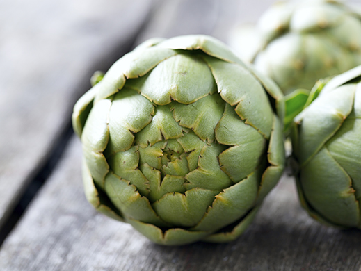 Artichoke on wooden table