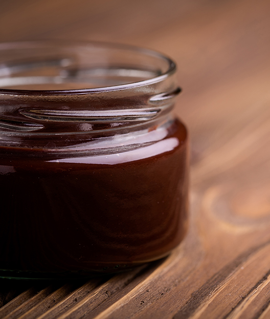 prune juice concentrate on wooden table