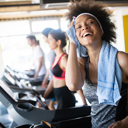 Group of healthy fit people at the gym exercising