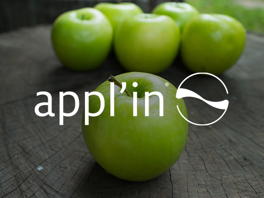 Appl'in brand on apples background