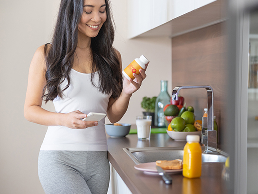 woman looking at label of health products